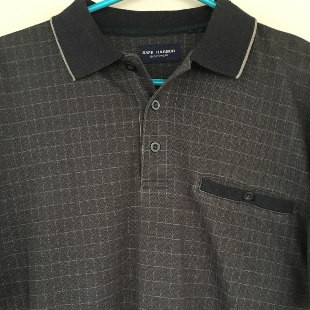 Mens short sleeve 3 button down with colar and a front button pocket.